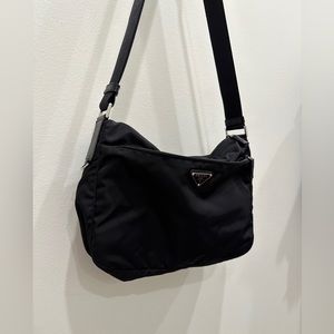 Prada cross body black nylon with zipper.
12w 10h 2.5d.  Barely used.